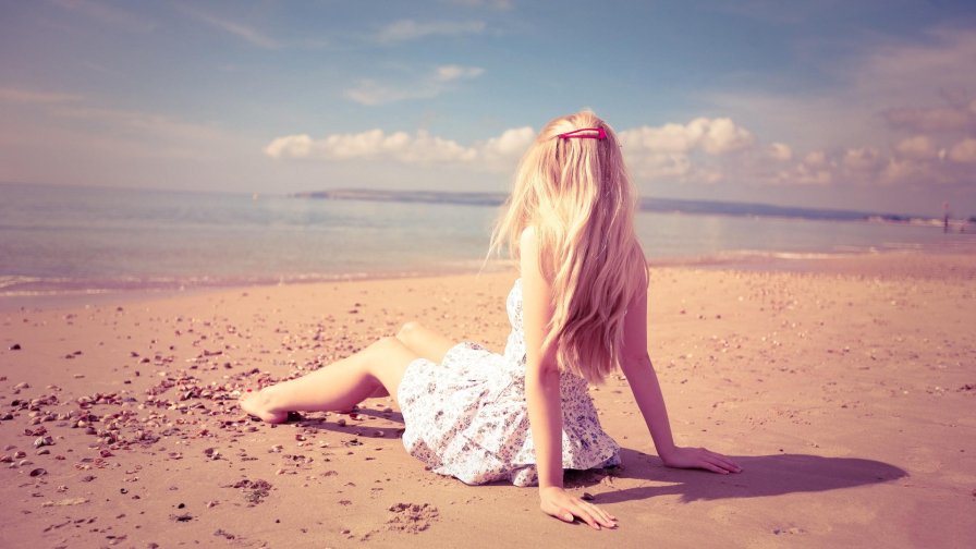 Beautiful Blonde Girl on the Beach