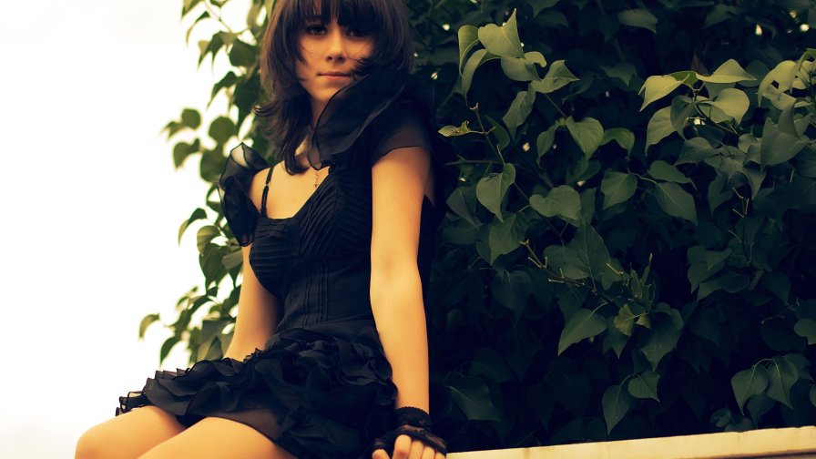 Beautiful Brunette Girl in Black Dress
