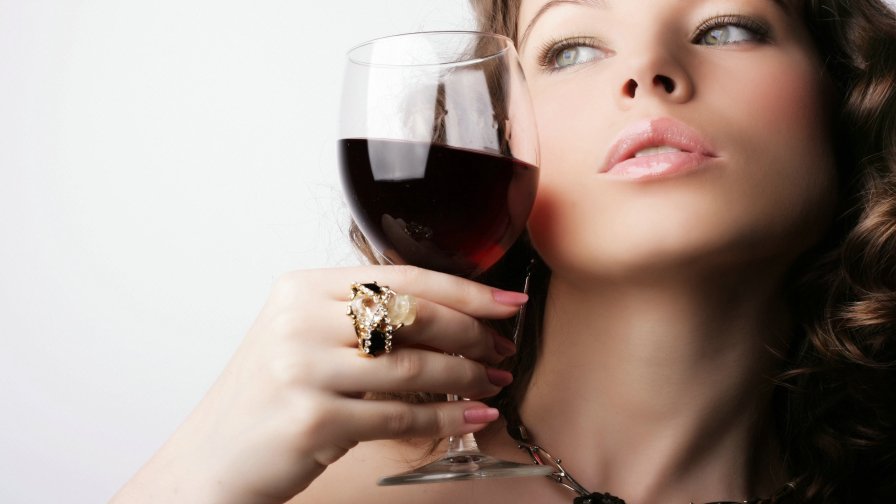 Beautiful Brunette Girl with a Wine Glass
