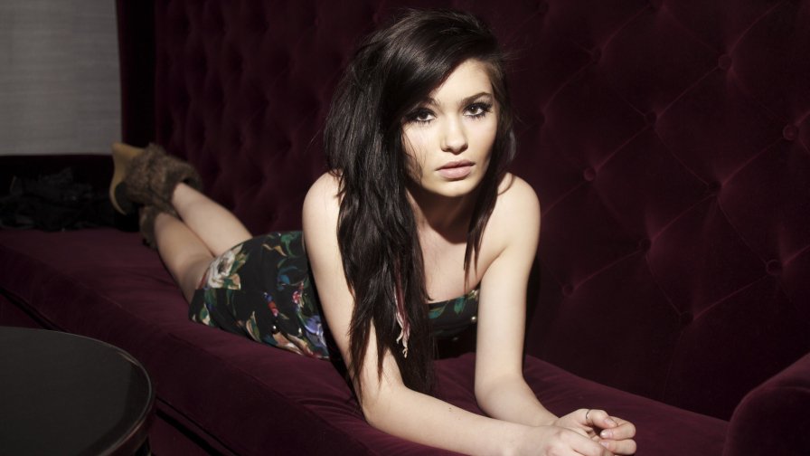 Beautiful Brunette Teen Girl on the Sofa