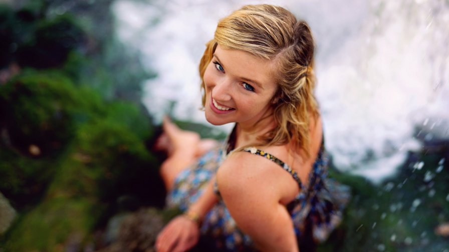 Beautiful Smiling Girl and Waterfall