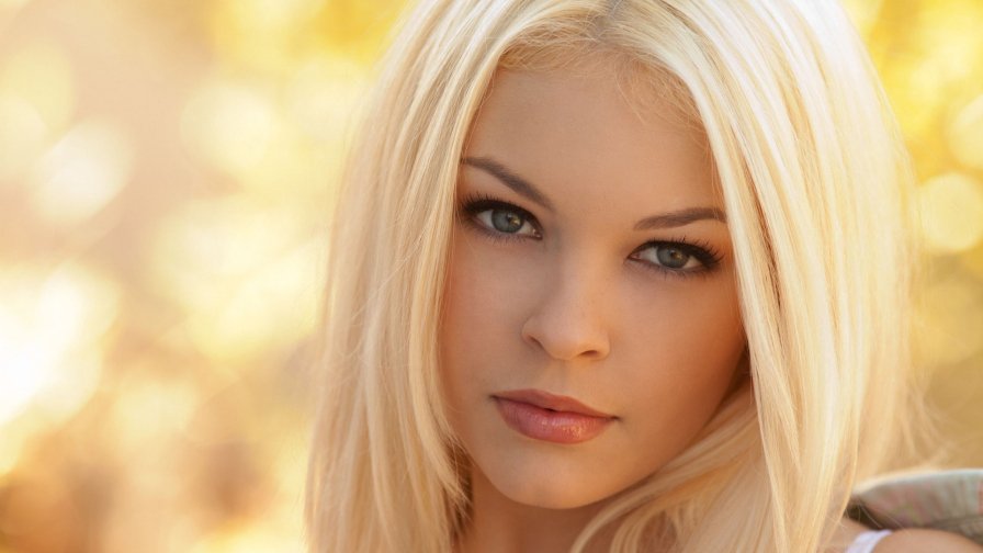 Blonde Girl with Beautiful Green Eyes