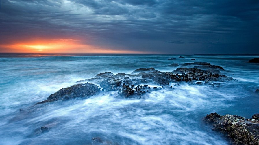 Blue Ocean Waves and Stones