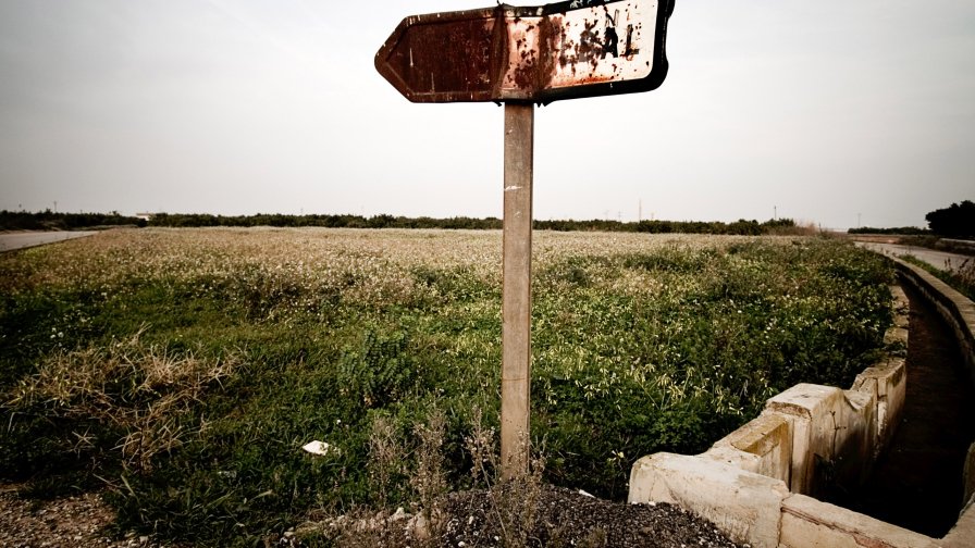 Field and Old Road Sign