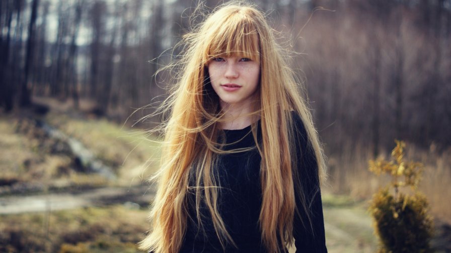 Pretty Young Redhead Girl in the Forest