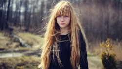 Pretty Young Redhead Girl in the Forest