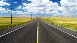 Road in the Field and Clouds in Sky