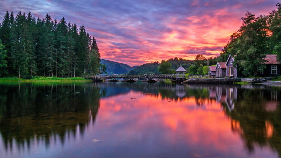 Sunset on the Lake Green Forest and Mountains